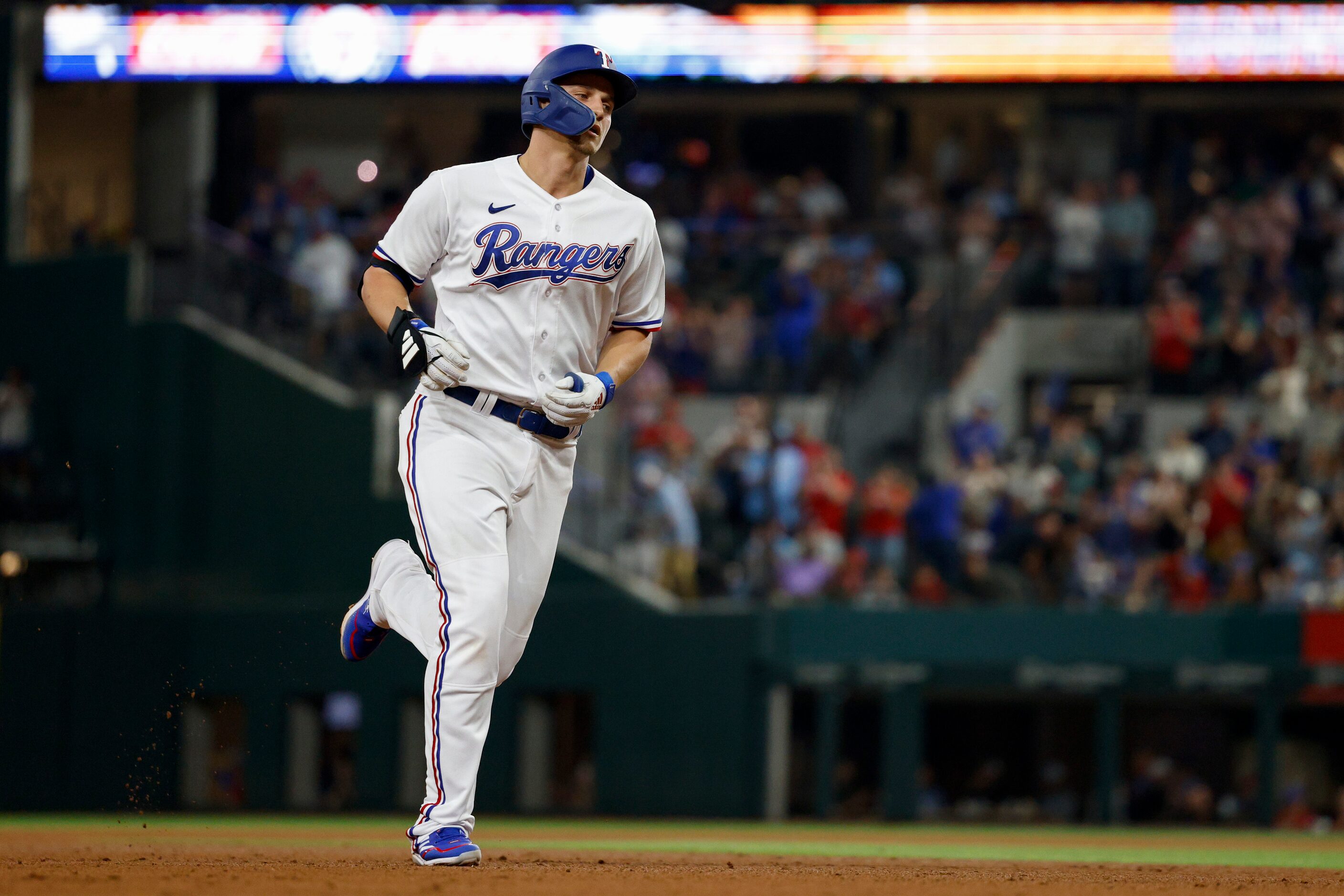 Texas Rangers shortstop Corey Seager (5) rounds the bases after hitting a home run to...