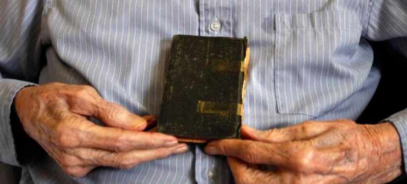 
Ben Spurger, 94, said his father began crying after giving him this Bible before he left to...