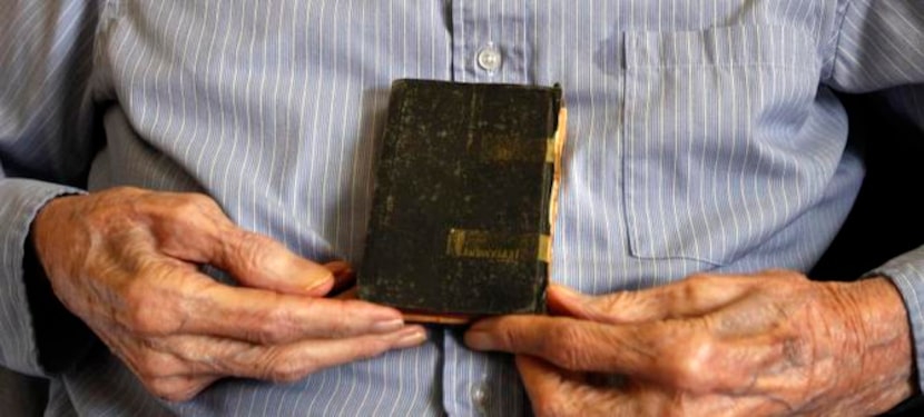 
Ben Spurger, 94, said his father began crying after giving him this Bible before he left to...