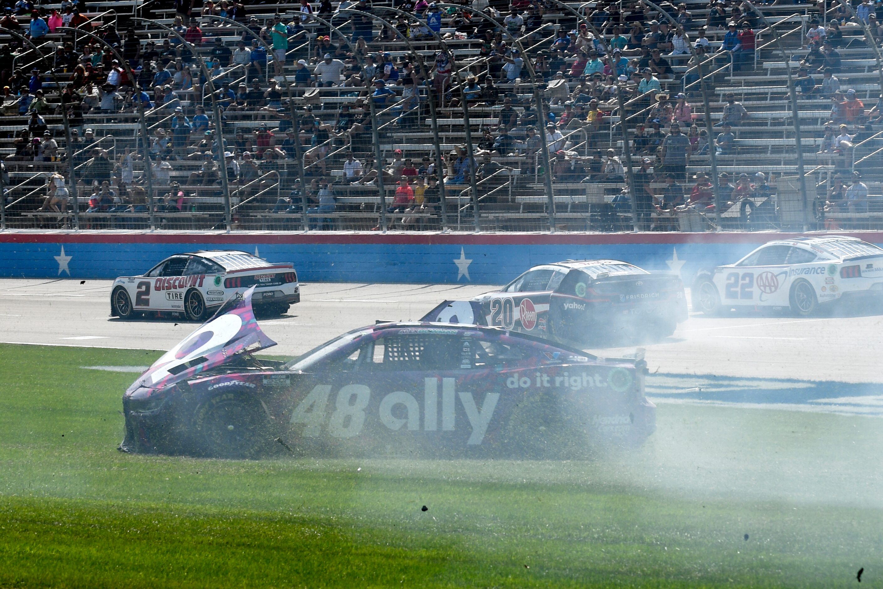 Alex Bowman (48) spins out on the infield after crashing coming out of Turn 4 during a...