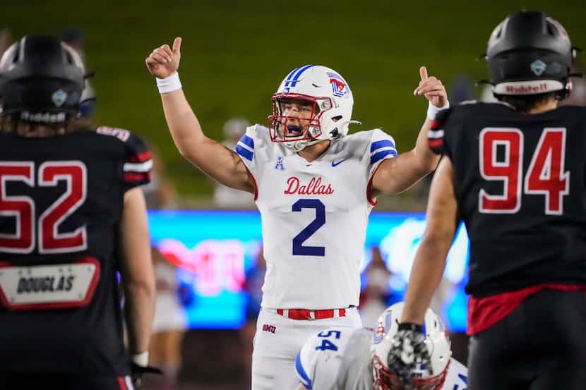 SMU quarterback Preston Stone signals a play during the second half of an NCAA football game...