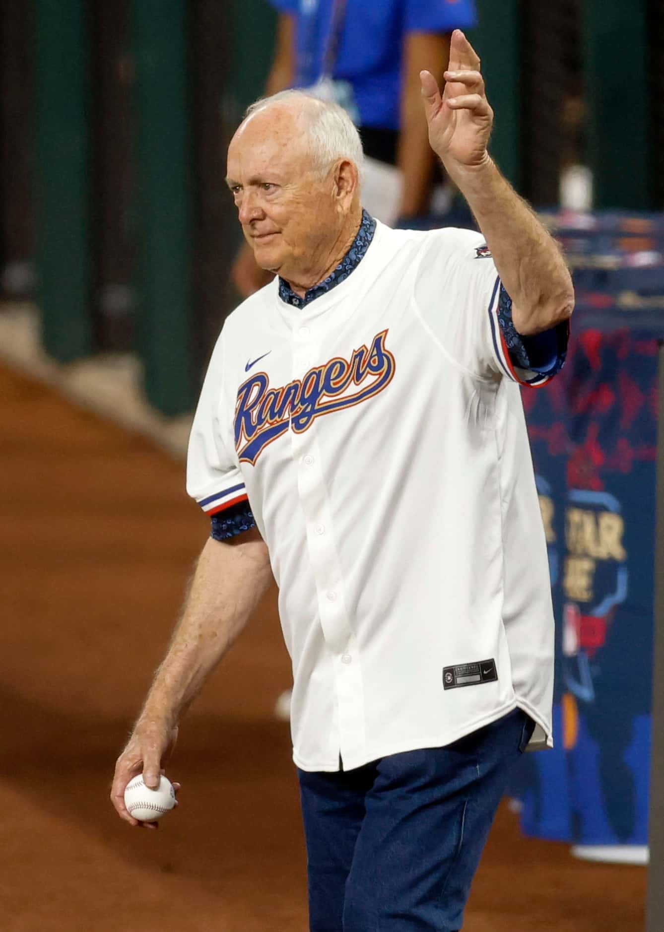 Hall of Famer Nolan Ryan waves to the crowd before the ceremonial first pitch before the MLB...