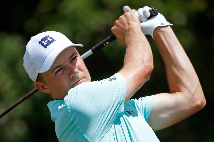 Jordan Spieth watches his tee shot on the 9th hole during the first round of Fort Worth...