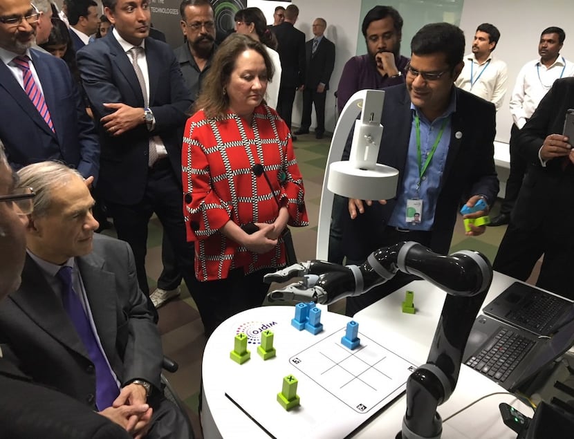 In 2018, Texas Gov. Greg Abbott played tic-tac-toe with a robot in Bengaluru, India, as...