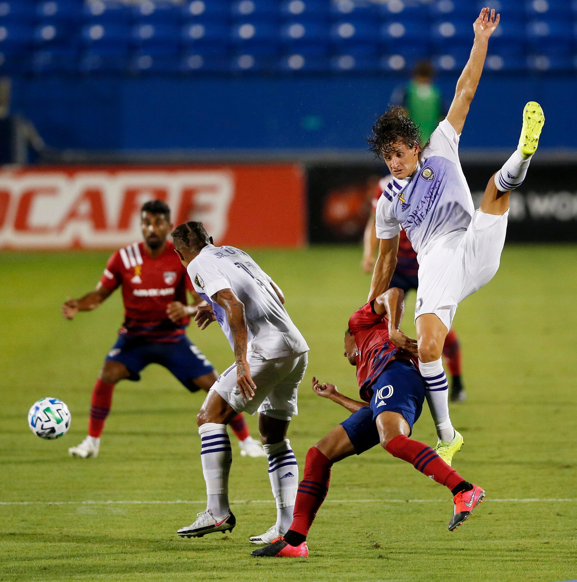 Orlando City defender Rodrigo Schlegel (15) and FC Dallas Pablo Aránguiz (10) collide during...