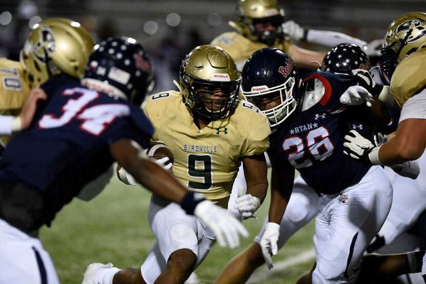 Birdville running back Laderrious Mixon (9) carries the ball against Denton Ryan during the...