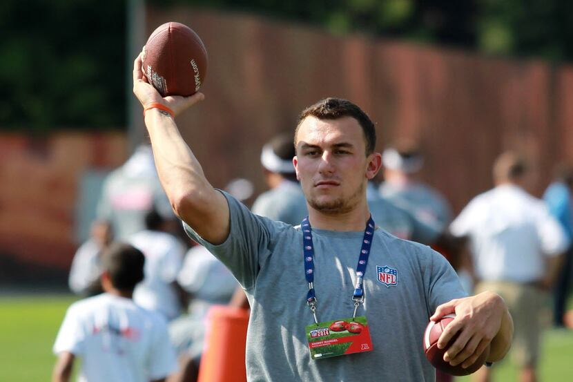 Cleveland Browns' Johnny Manziel throws a pass during an NFL football Play 60 youth event at...