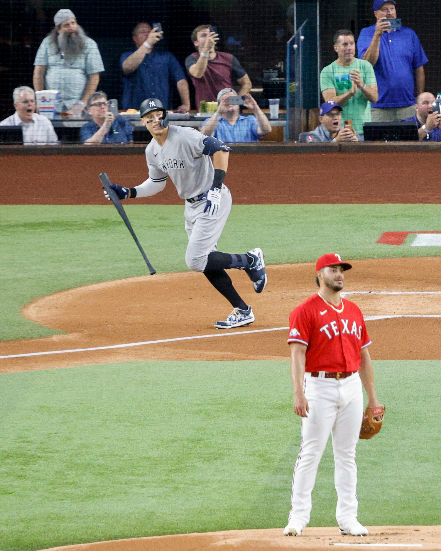 New York Yankees right fielder Aaron Judge (99) watches the ball after hitting a home run to...