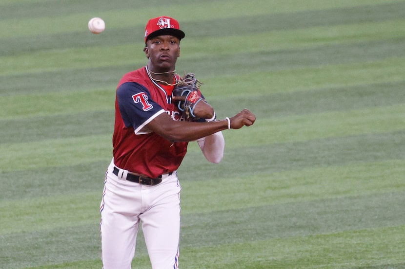 American League's shortstop Sebastian Walcott (1) throws to first during the third inning of...