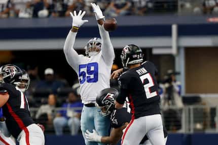 Dallas Cowboys defensive end Chauncey Golston (59) jumps to block a pass from Atlanta...