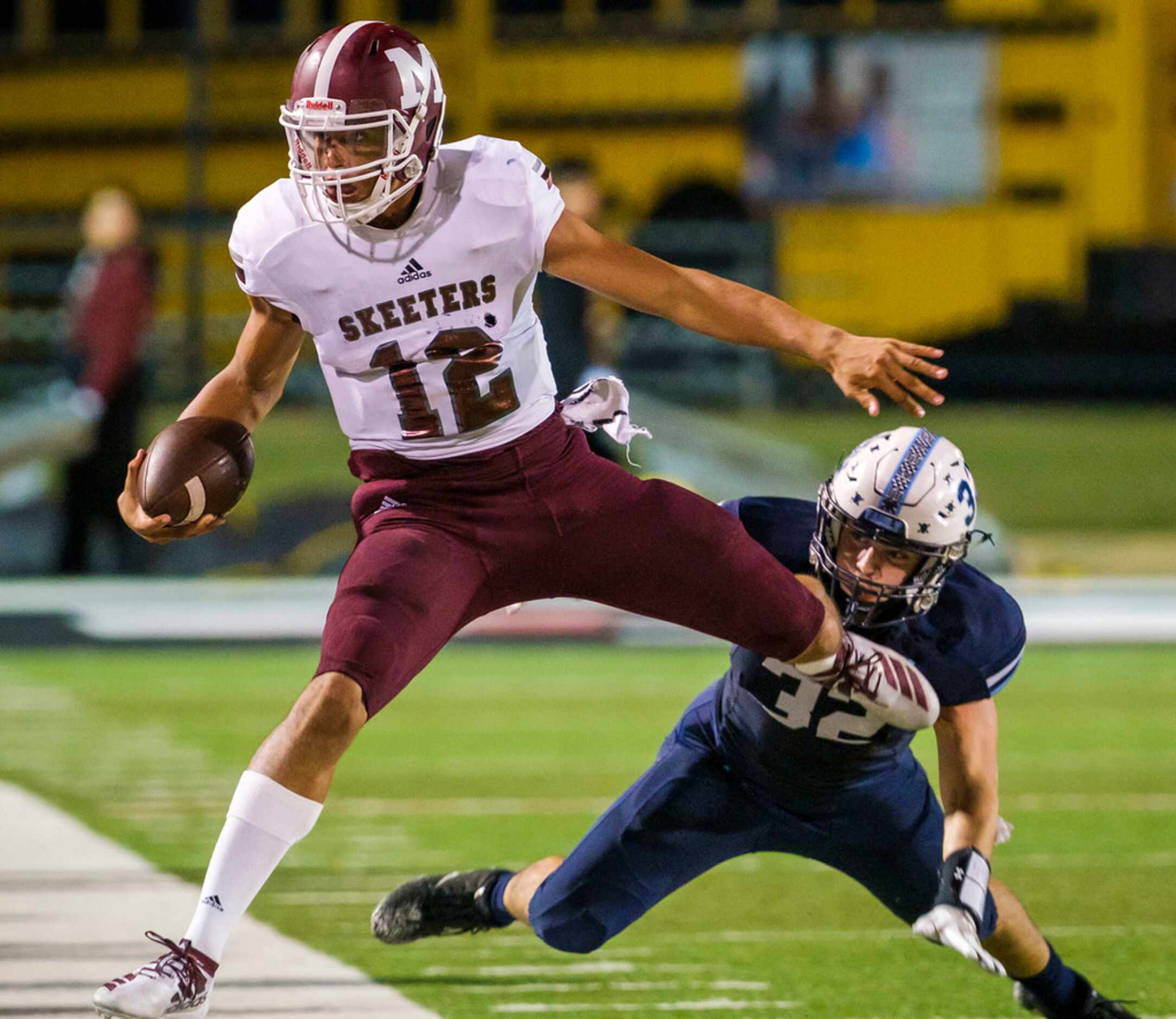 Mesquite quarterback Dylan Hillard-McGill (1is pushed out of bounds by L.D. Bell middle...