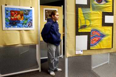 In this 2005 file photo, Angela McPherson examined artwork at the Richardson Civic Arts...