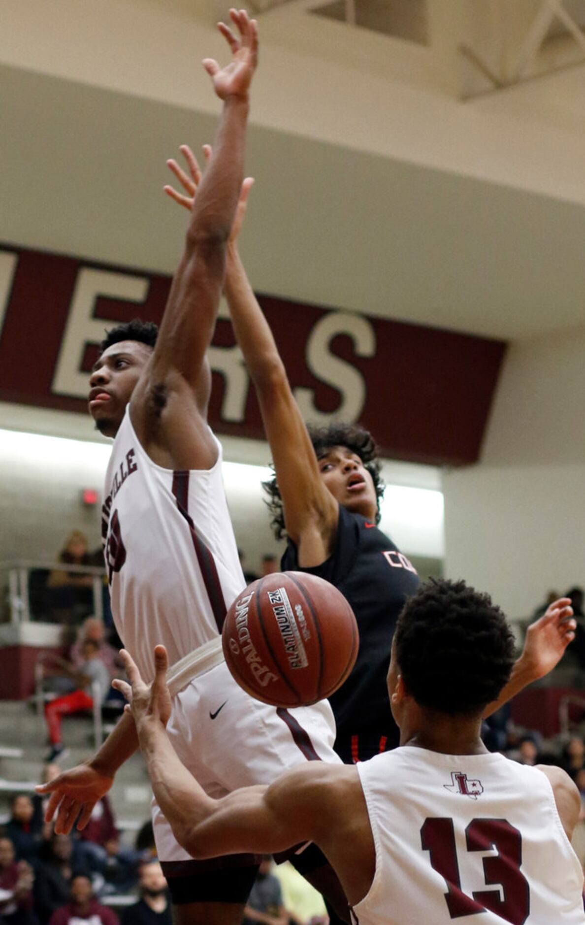 Lewisville's OC Girtmon (10) left, is fouled on his drive to the basket when Coppell's...