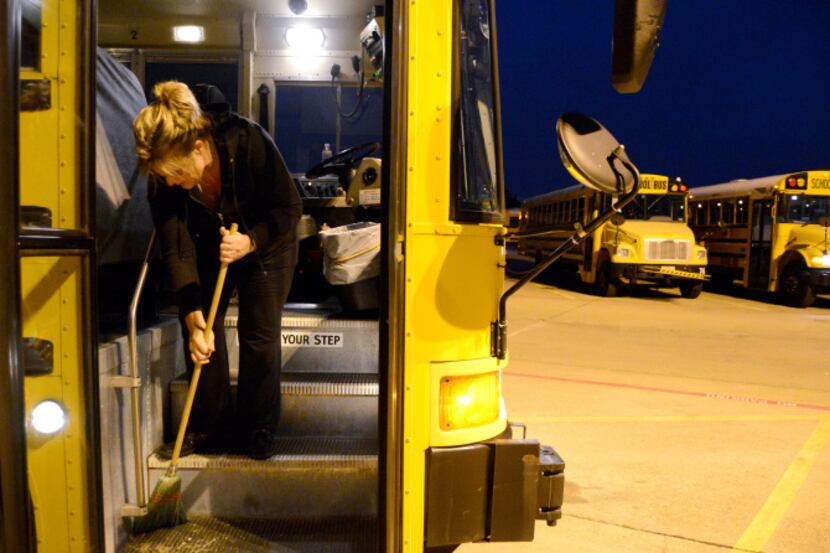 Allen ISD driver Susan Ricketts cleans her bus at the service center on Butler Drive, which...