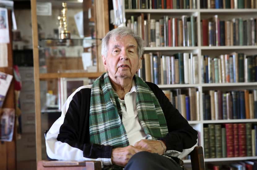 Larry McMurtry poses in the bookstore in 2014. “He wanted to take a bookless town and a...