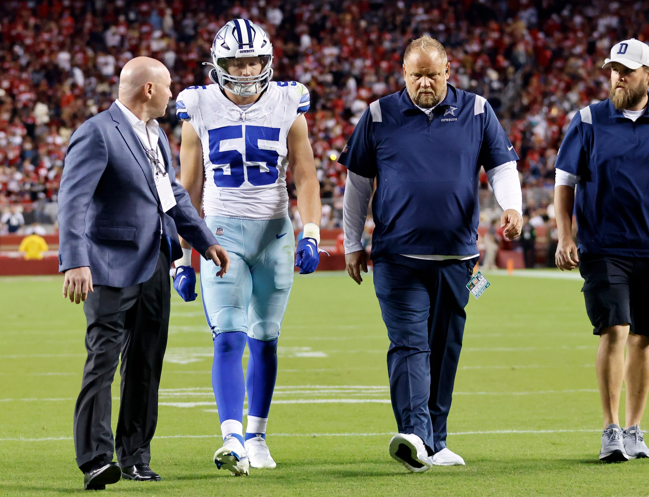 Dallas Cowboys linebacker Leighton Vander Esch (55) walks on his own to the medical room...