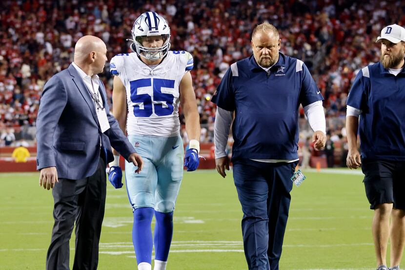 Dallas Cowboys linebacker Leighton Vander Esch (55) walks on his own to the medical room...