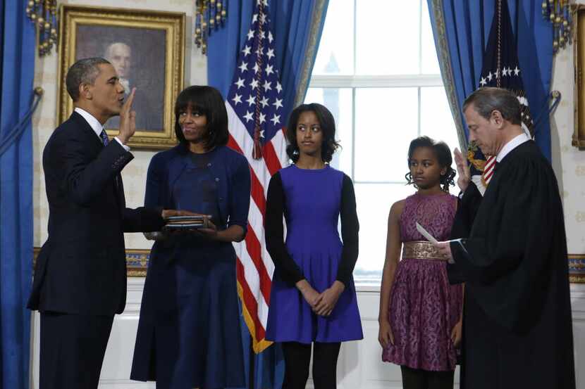 President Barack Obama takes the oath of office during the official swearing-in ceremony at...