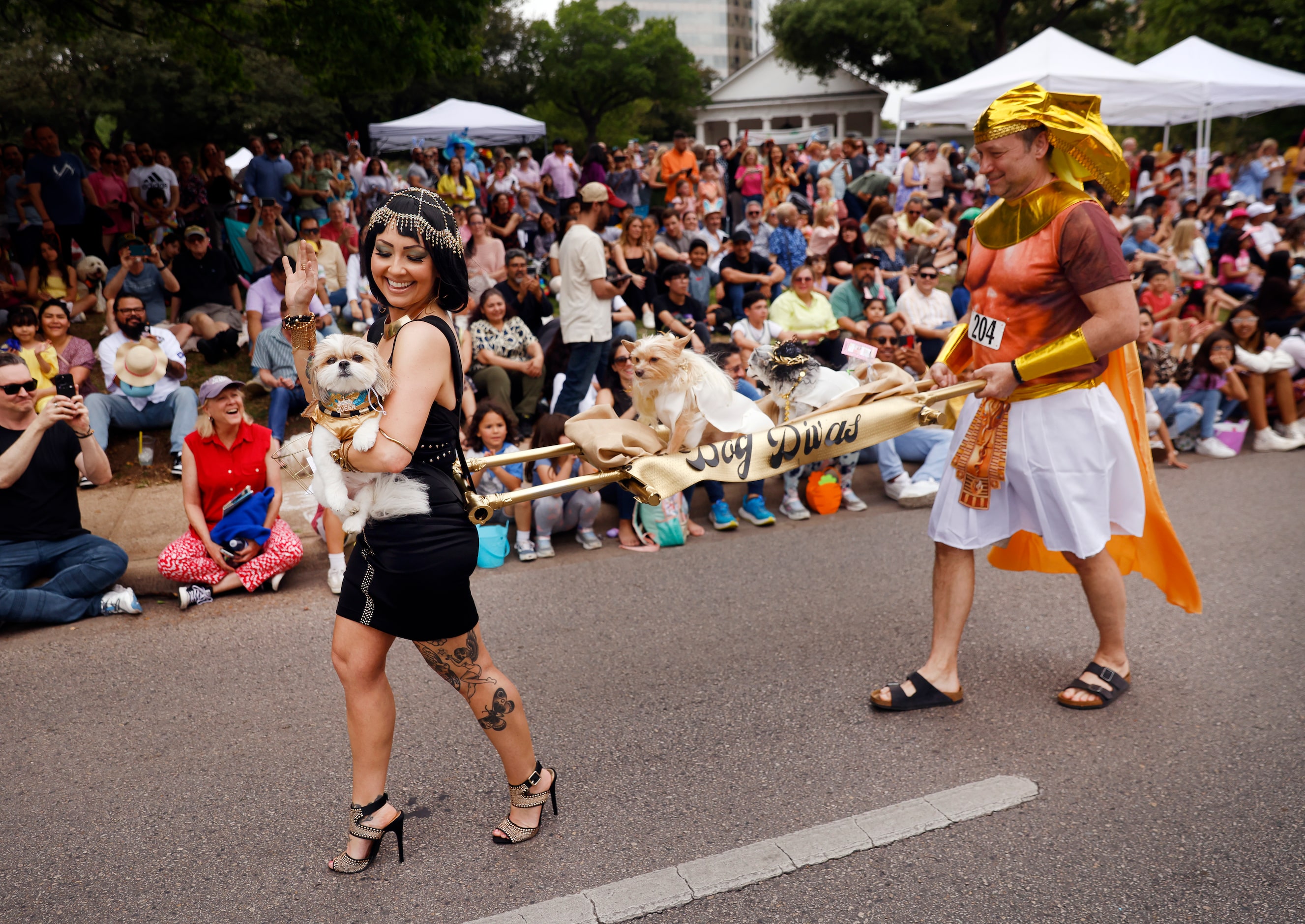 Melanie Fox dressed her Shih Tzu ‘Cleopatra’ (in hand, left), her Yorkie-mix ‘Ameera’ and...