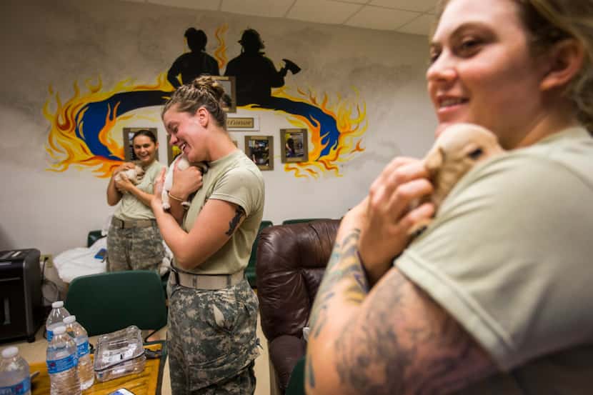 National Guard troops from left, Private First Class Taylor Garen, Specialist Kyleigh Neese...