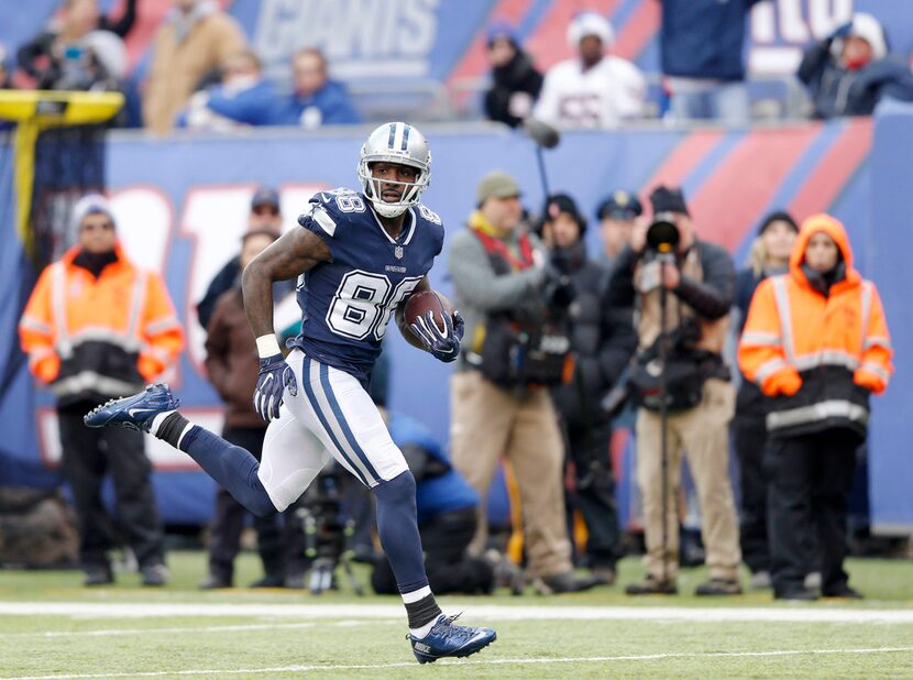 Dallas Cowboys wide receiver Dez Bryant (88) runs after the catch for a 50 yard touchdown...