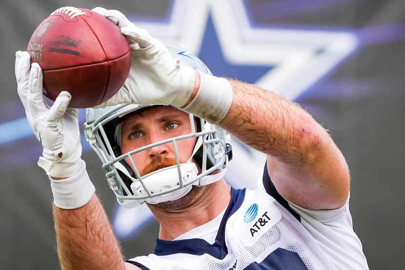 Dallas Cowboys tight end Dalton Schultz catches a pass during a practice at training camp on...