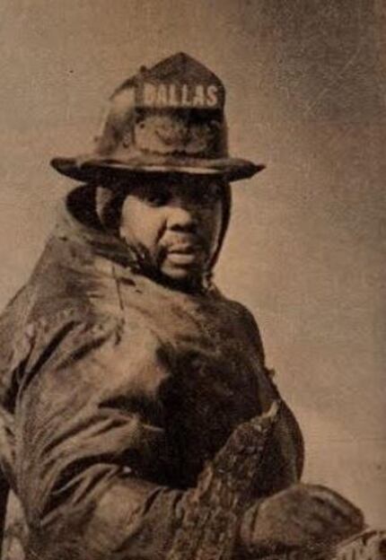 Firefighter Kenneth Parker in a department photo taken at a fire scene in the 1970s.