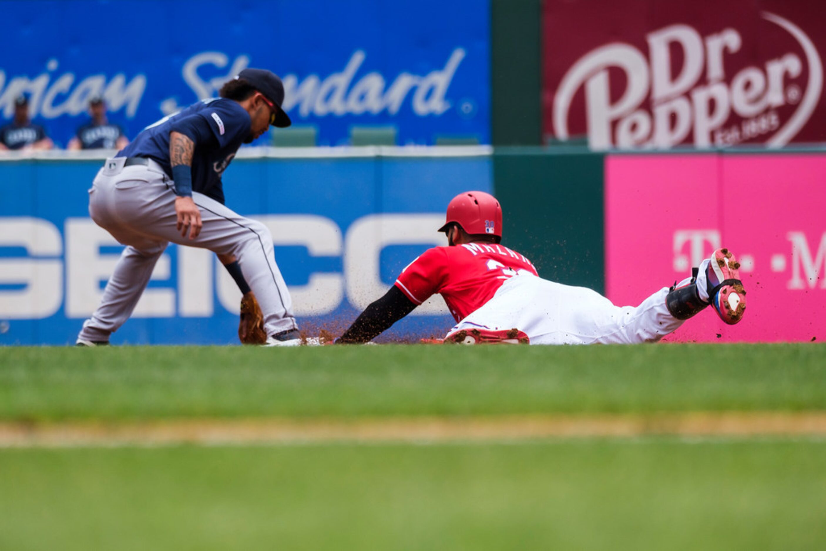 Texas Rangers right fielder Nomar Mazara is safe at second base with a double driving in a...