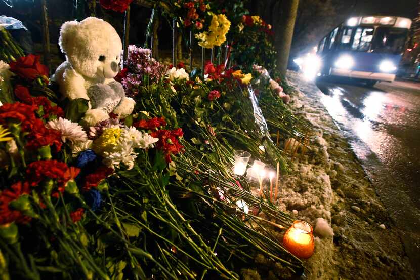 Flowers and toys are placed at the site of a trolleybus bombing in Volgograd, Russia,...