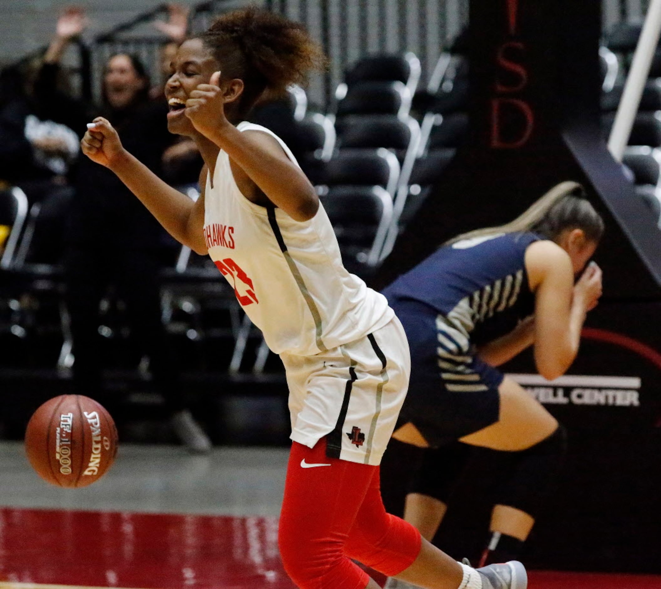 Liberty High School guard Randi Thompson (23) celebrates as time runs out in overtime while...