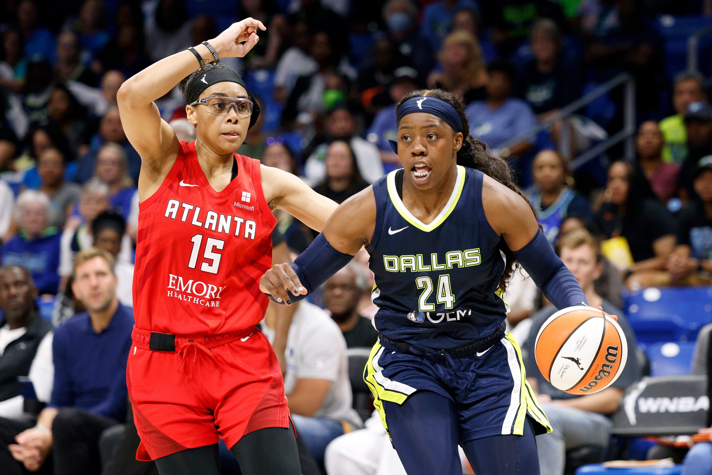 Dallas Wings guard Arike Ogunbowale (24) dribbles around Atlanta Dream guard Allisha Gray...