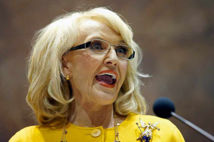 FILE - In this Jan. 13, 2014 file photo, Arizona Gov. Jan Brewer speaks during her State of...
