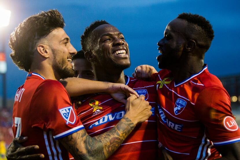 FC Dallas defender Maynor Figueroa (31, center) celebrates with team mates after he scored a...