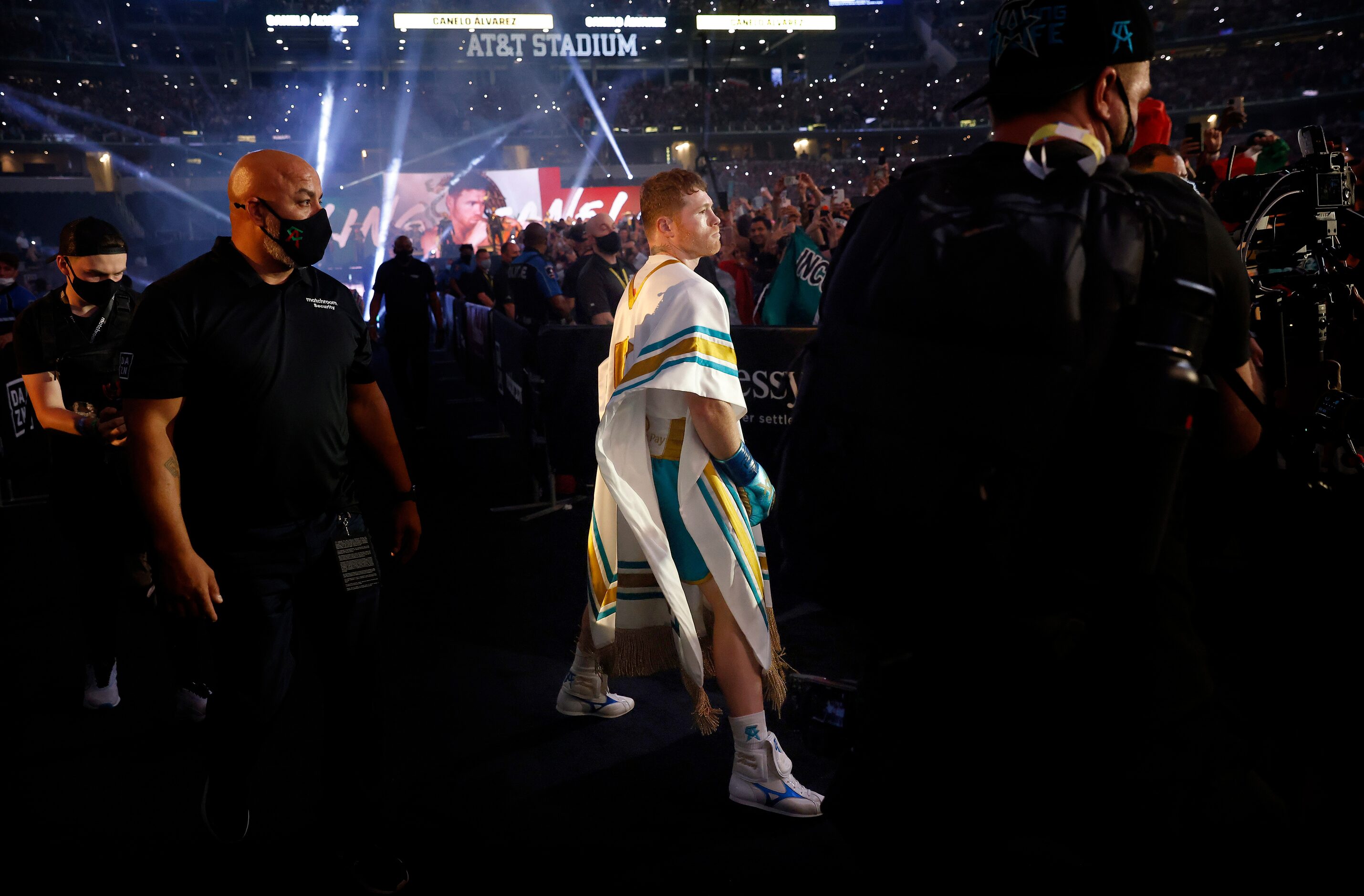 Boxer Canelo Alvarez struts to the ring as he's introduced to a mostly favorable crowd...