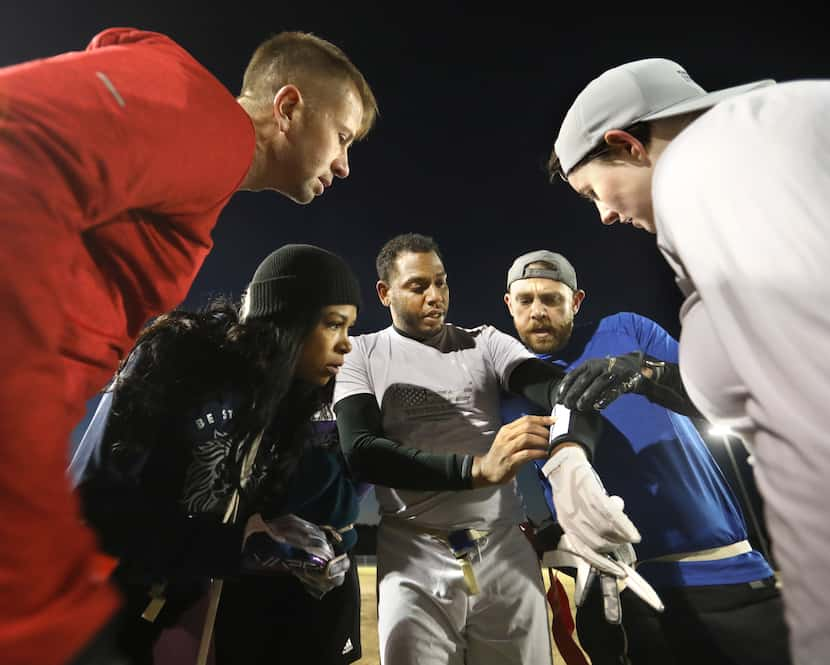 Maurice Head, center, calls a huddle during a National Gay Flag Football League practice...