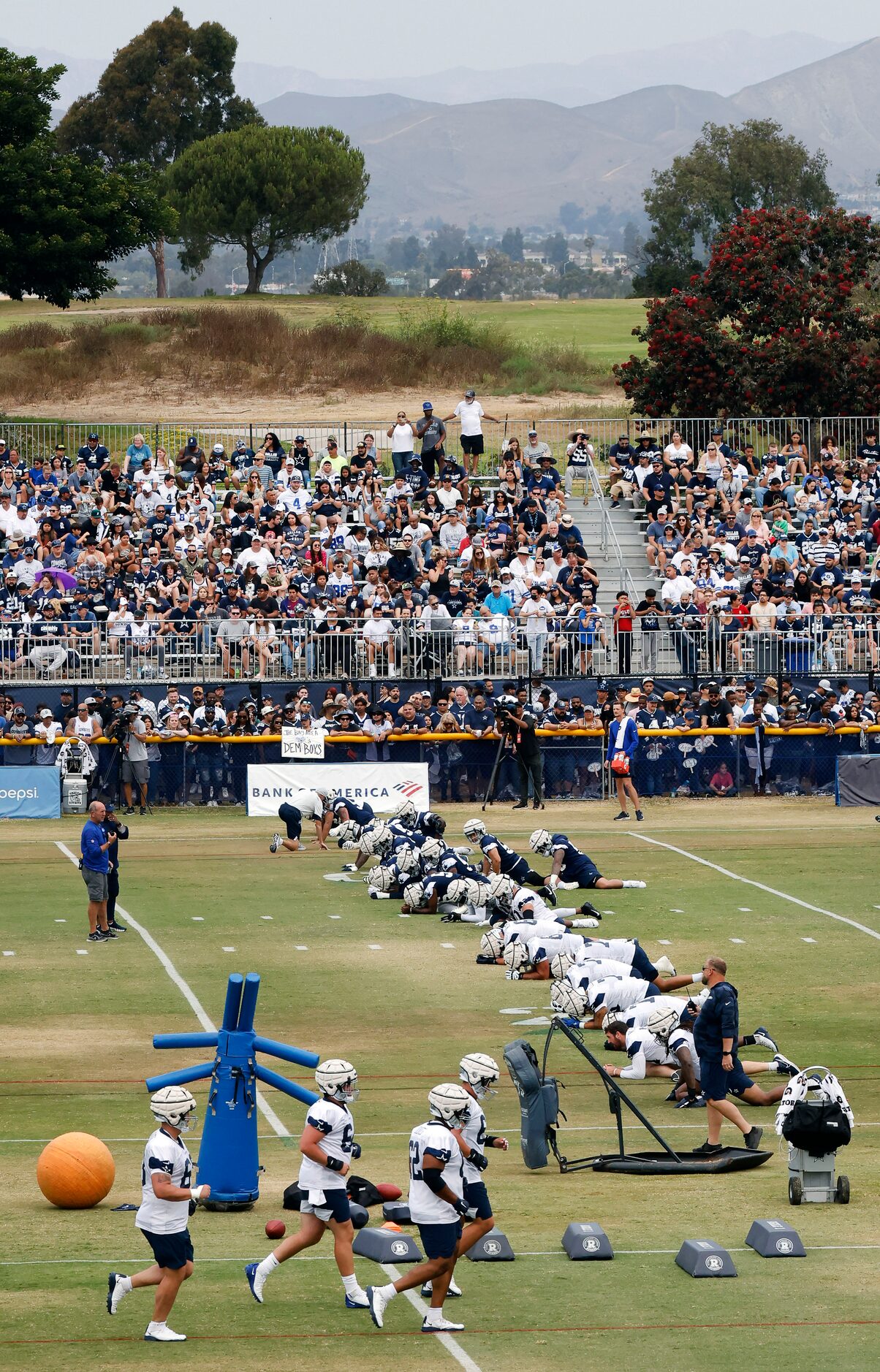 The Dallas Cowboys football team trains before over 4,000 fans at the Cowboys training camp...