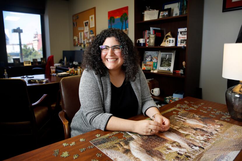 Assistant U.S. attorney Nicole Dana, whose office includes a puzzle table where she and...