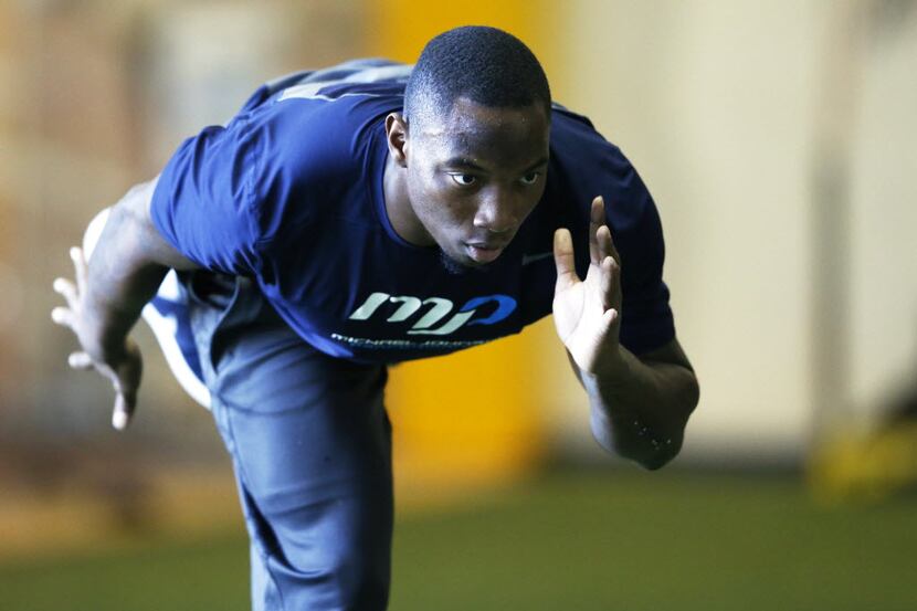 Derrick Kindred works on an exercise during a workout at Michael Johnson Performance Center...