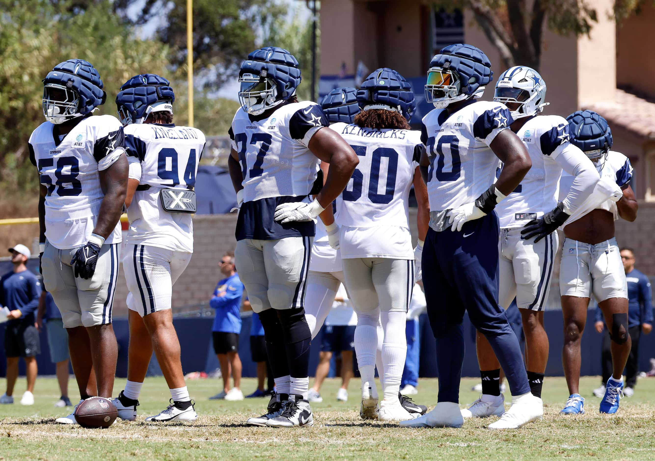 The Dallas Cowboys first team defensive line catches a breather between training camp...