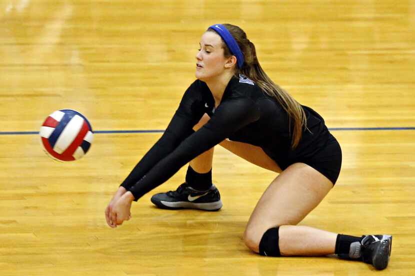 Hebron's Jordan Yauch digs a hit by Plano West during their game Tuesday, October 20, 2015...