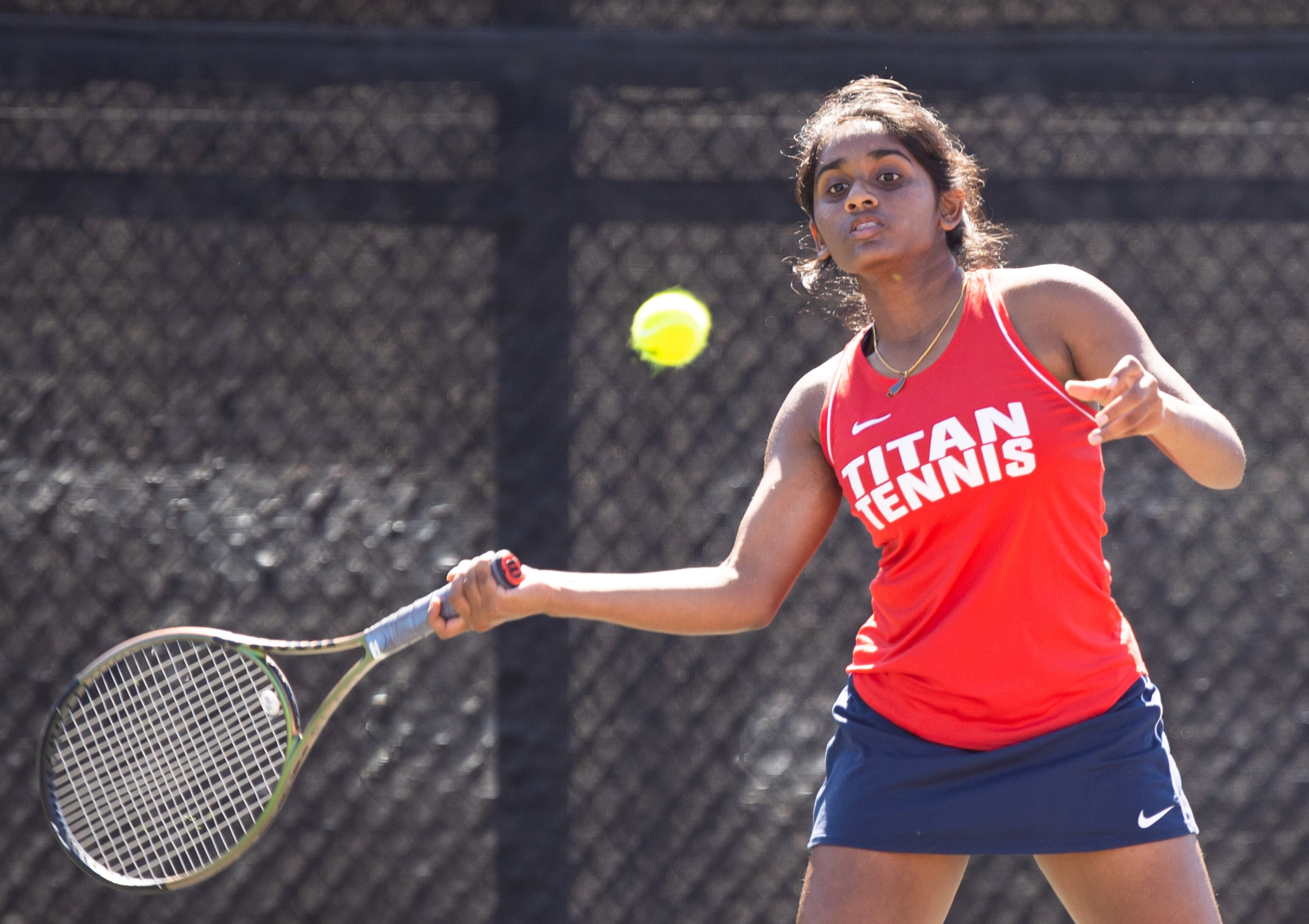 Frisco Centennial’s Sahasra Dodda returns a shot during a doubles match with partner Noa...