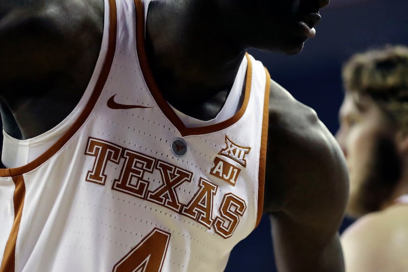Texas forward Mohamed Bamba (4) wears an "AJ1" logo on his jersey during the first half of...