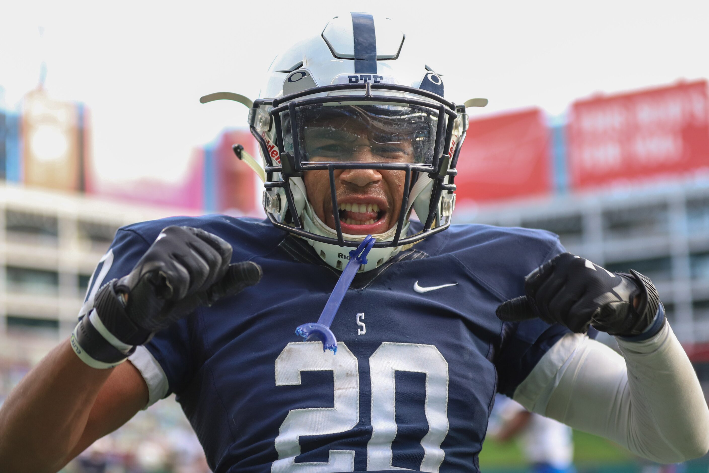 Fort Worth All Saints running back Nichlas Cole (20) flexes after a touchdown against Fort...