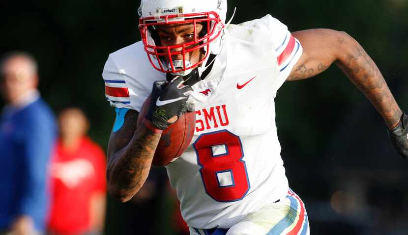 SMU receiver Reggie Roberson Jr (8) sprints to the end zone after pulling in a pass and...