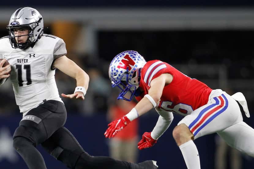 Denton Guyer quarterback Jackson Arnold (11) scrambles out of the backfield to avoid the...