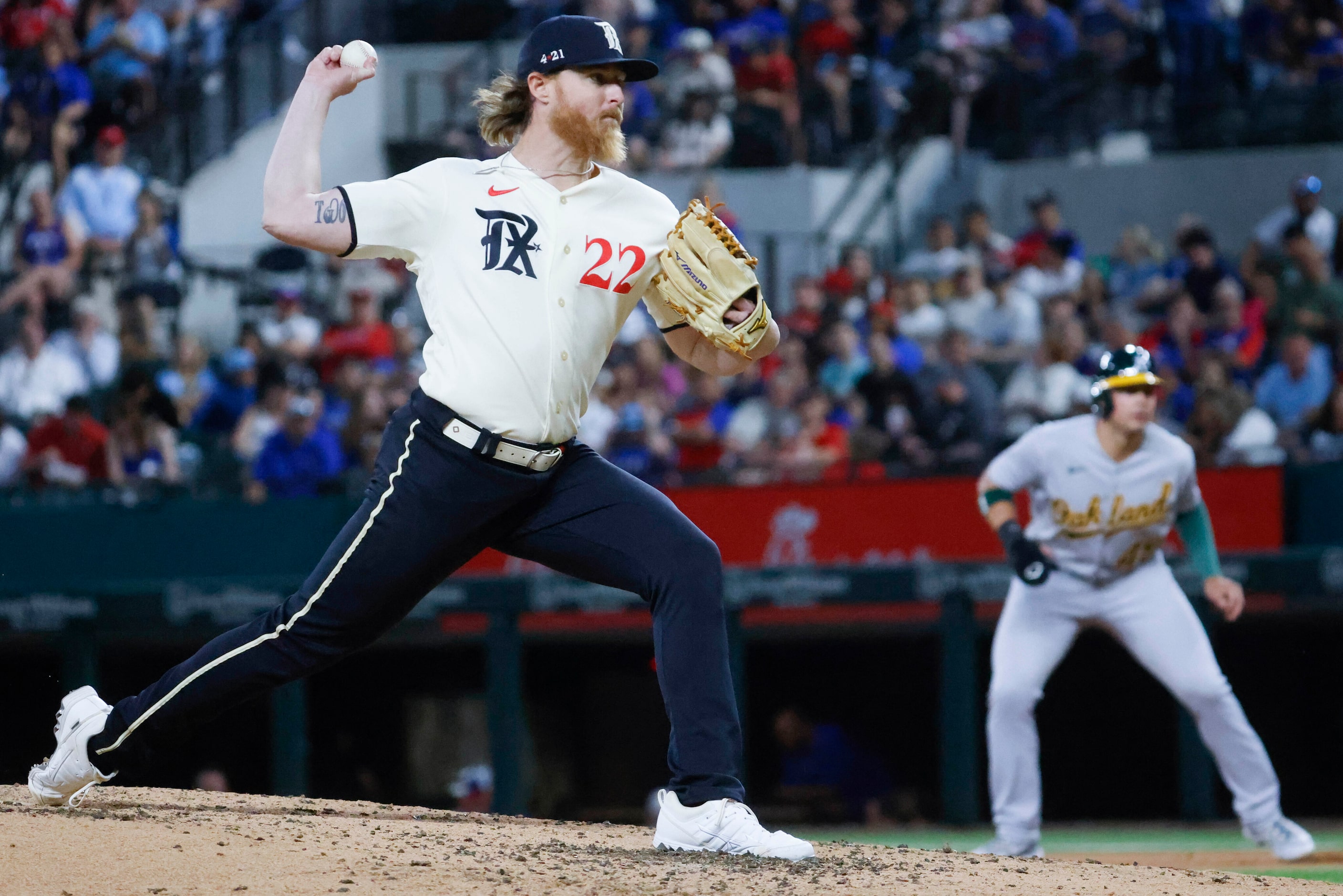 Texas Rangers starting pitcher Jon Gray throws during the third inning of a baseball game...