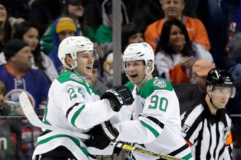 Dallas Stars' Roope Hintz (24) celebrates a goal with teammate Jason Spezza (90) during the...