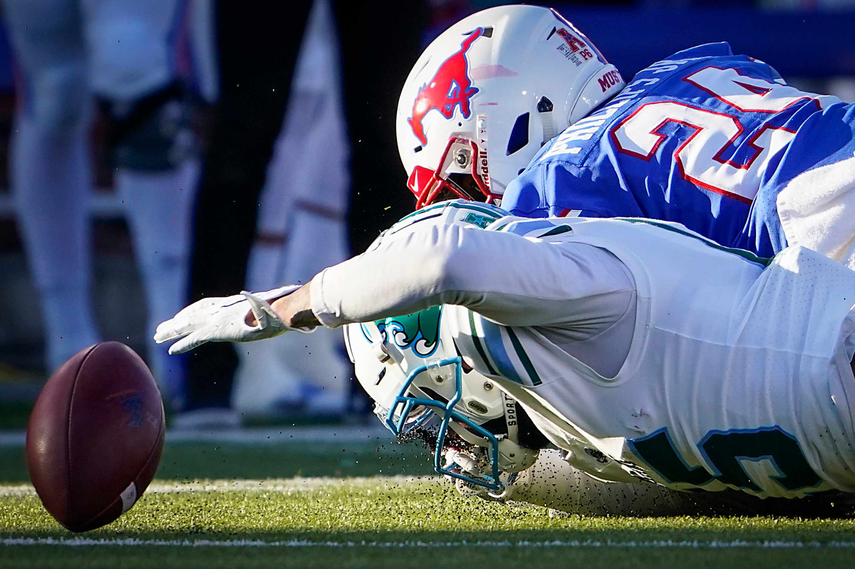 Tulane wide receiver Jacob Robertson Jr. (15) fumbles on a punt return a he is hit by SMU...