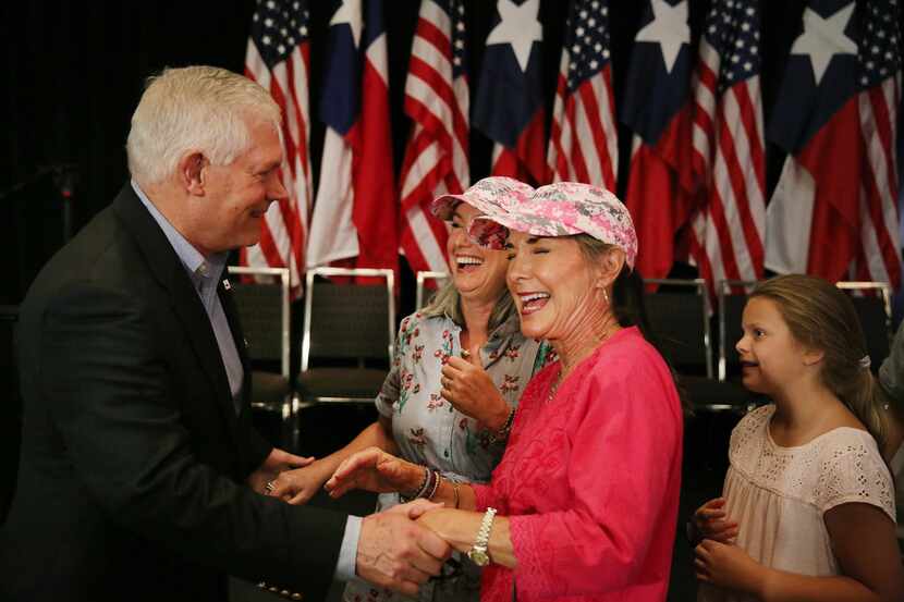 U.S. Rep. Pete Sessions greets Millie Winston (center) and Debra Woolsey (second from...