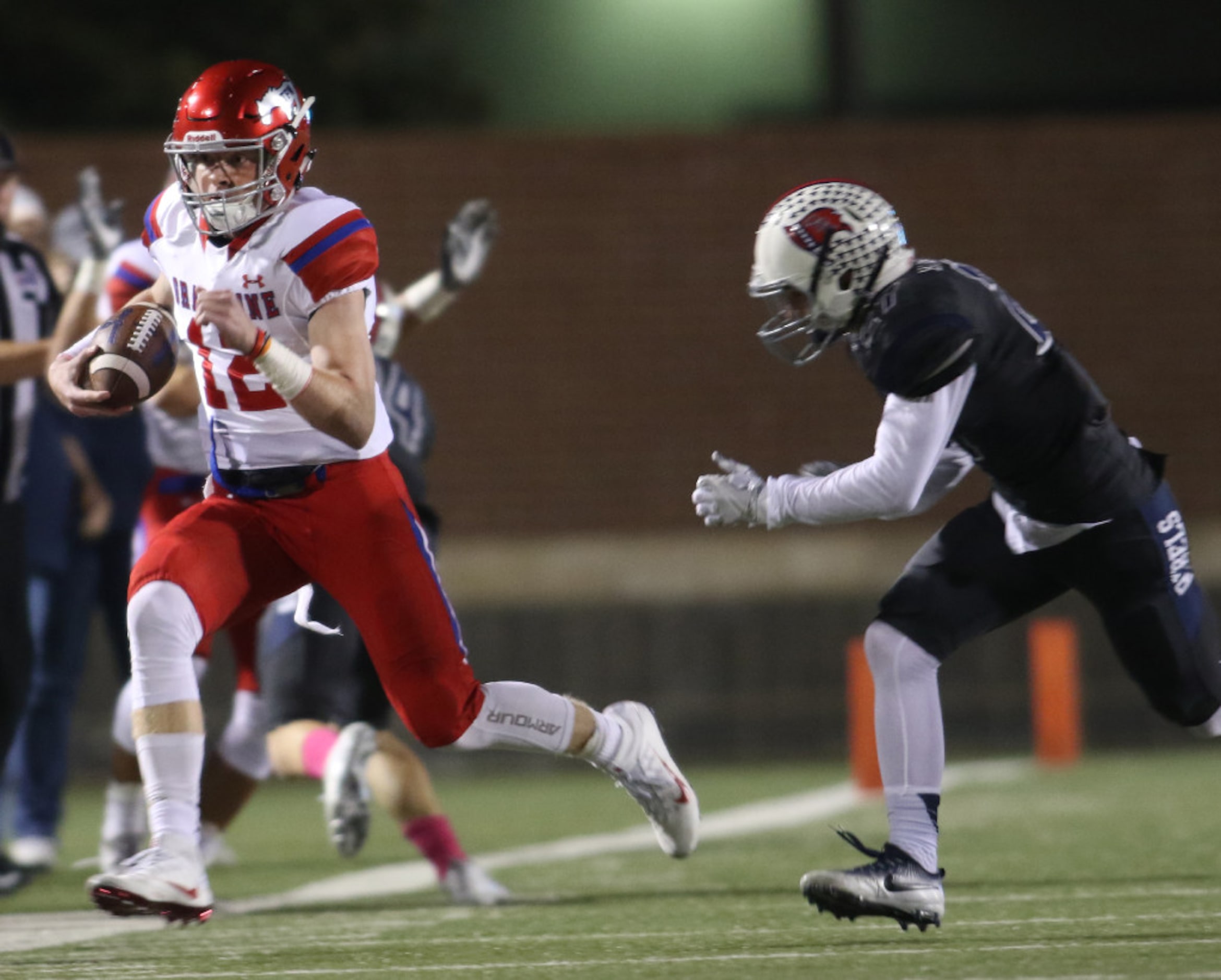 Grapevine quarterback Alan Bowman (12) scampers down the sideline as Richland defender Clay...